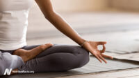women sitting in lotus pose